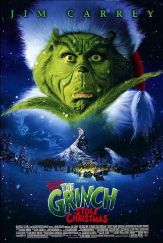 Movie poster for 'How the Grinch Stole Christmas,' with a closeup of a grinning Jim Carrey in his green Grinch makeup and a Santa Claus hat, with one hand under his chin and an expression that makes it look like he's just had a brilliant and devious idea. Under his face is the mountain on which he lives, and all of the town of Whoville below, just above the movie title.