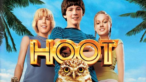 The three main characters of HOOT stand against a tropical backdrop. An owl's head is in the foreground.