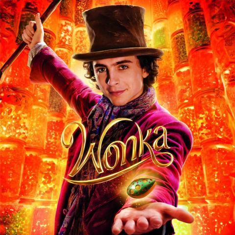 Wonka movie poster. Willy Wonka holds a magical cocoa bean against an orange background.