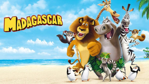 A wide image of a beach under the sun, showing the cast of the film Madagascar next to the title card.