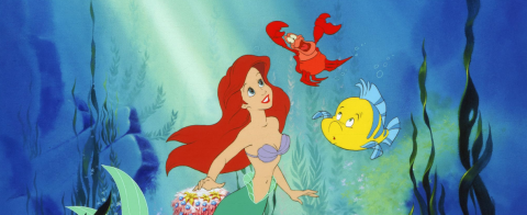 Wide image of Ariel, Sebastian, and Flounder swimming and talking together, from the 1989 film 'The Little Mermaid.'