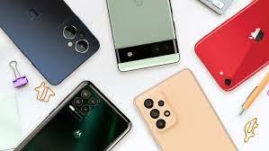 Several smartphones are arranged facedown against a white background.